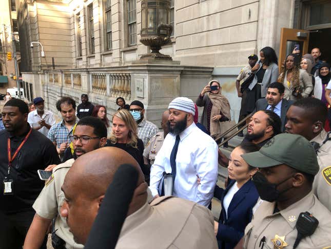 Adnan Syed, center, leaves the Elijah E. Cummings Courthouse, Monday, Sept. 19, 2022, in Baltimore. A judge has ordered the release of Syed after overturning his conviction for a 1999 murder that was chronicled in the hit podcast “Serial"