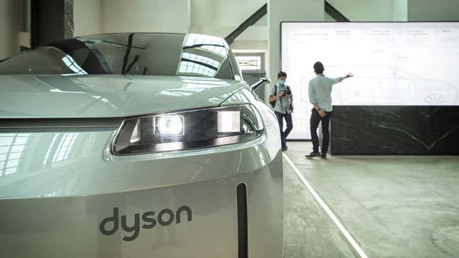 A photo of a Dyson badge on a car. 