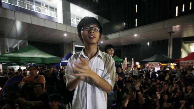 Convener of the students group "Scholarism" Joshua Wong attends a sit-in protest outside the government headquarters in Hong Kong, Wednesday, Sept. 5, 2012. Protesters urged the government to cancel new additional course, "Moral and National Education" subject, to be introduced for school curriculum, starting from a new school year. (AP Photo/Kin Cheung