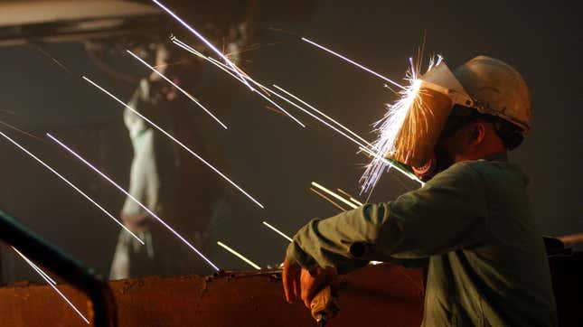  worker is struck in the face with sparks from molten steel flowing into casts.