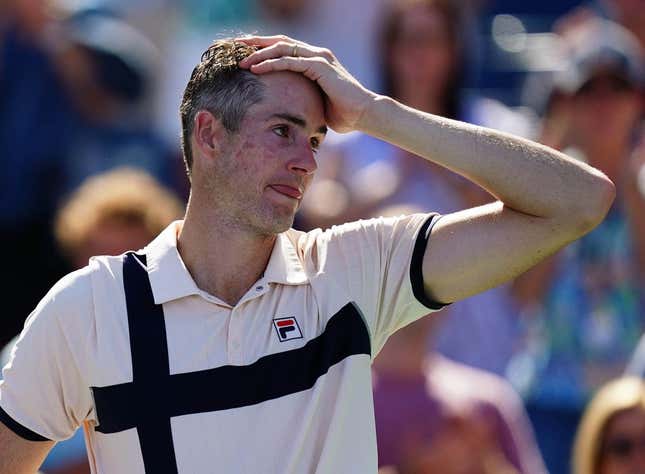 Aug 31, 2023; Flushing, NY, USA;  John Isner of the United States reacts as he is interviewed after losing his second round match against Michael Mmoh of the United States on day four of the 2023 U.S. Open tennis tournament at the USTA Billie Jean King National Tennis Center.