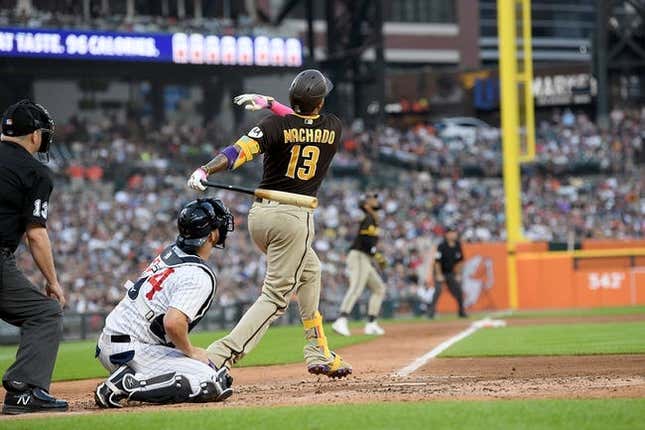 Jul 22, 2023; Detroit, Michigan, USA; San Diego Padres third baseman Manny Machado (13) hits a three-run home run against the Detroit Tigers in the third inning at Comerica Park.