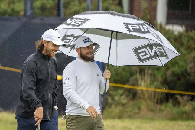July 18, 2023; Hoylake, ENGLAND, GBR; Tommy Fleetwood (left) and Tyrrell Hatton (right) talk on the fourth hole during a practice round of The Open Championship golf tournament at Royal Liverpool.
