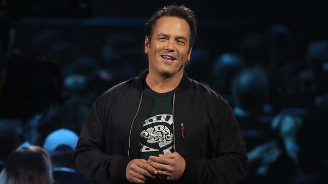 Phil Spencer stands on stage at an E3 showcase. 