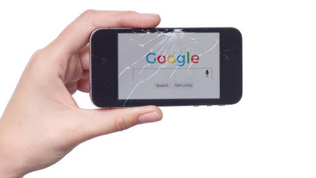 The Google logo on a tiny cracked phone screen.