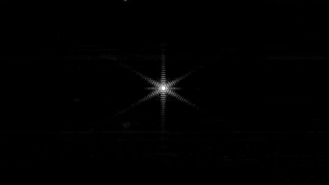 A bright light at center of this otherwise-black image is the star Webb is using to align its mirrors.