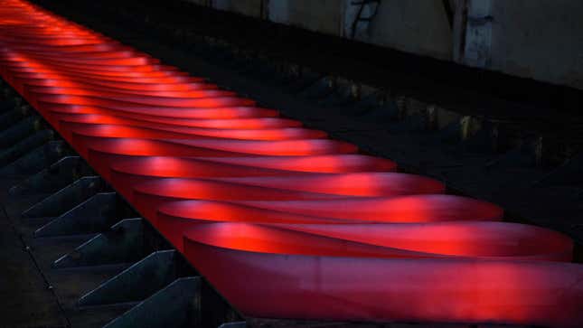 Red hot rolled steel is seen on the production line at Zhong Tian (Zenith) Steel Group Corporation.