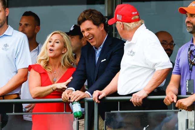 BEDMINSTER, NJ - JULY 31: Former President Donald Trump, Tucker Carlson and Marjorie Taylor Greene during the 3rd round of the LIV Golf Invitational Series Bedminster on July 31, 2022 at Trump National Golf Club in Bedminster, New Jersey.