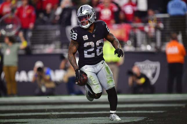January 1, 2023; Paradise, Nevada, USA; Las Vegas Raiders running back Josh Jacobs (28) scores a touchdown against the San Francisco 49ers during the second half at Allegiant Stadium.