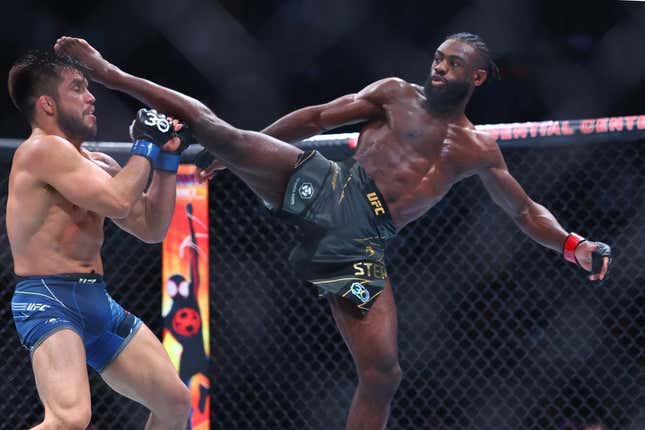 May 6, 2023; Newark, New Jersey, USA; Aljamain Sterling (red gloves) fights Henry Cejudo (blue gloves) during UFC 288 at Prudential Center.