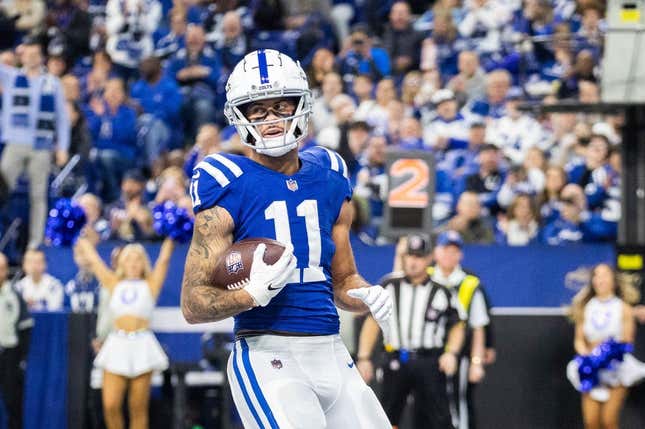 Jan 8, 2023; Indianapolis, Indiana, USA; Indianapolis Colts wide receiver Michael Pittman Jr. (11) scores a touchdown in the first quarter against the Houston Texans at Lucas Oil Stadium.