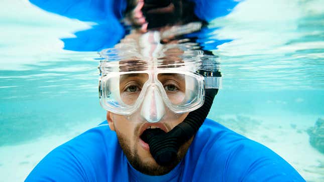 Image for article titled Vacationing Steph Curry Absolutely Gnawing On Snorkel