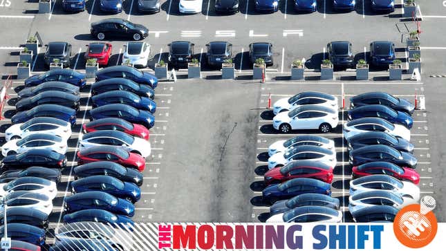In an aerial view, brand new Tesla cars sit in a parking lot at the Tesla factory on October 19, 2022 in Fremont, California.