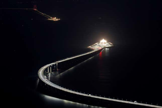A view from Hong Kong, showcasing the bridge and the tunnel entrances and exits.