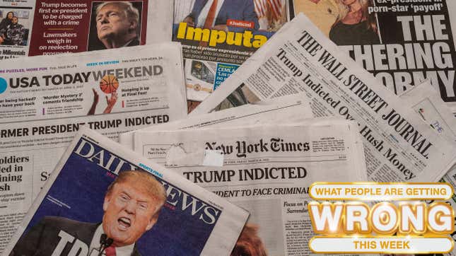 A collection of print newspaper articles with headlines announcing the indictment against Trump