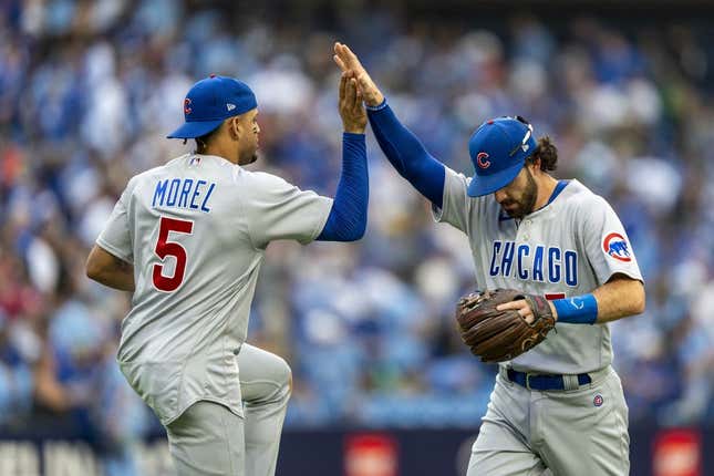 Aug 12, 2023; Toronto, Ontario, CAN; Chicago Cubs second baseman Christopher Morel (5) celebrates with teammate shortstop Dansby Swanson (7) after defeating the Toronto Blue Jays at Rogers Centre.