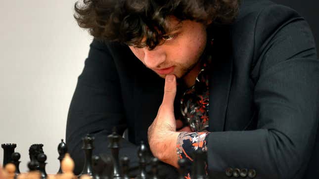 Chess Grandmaster Hans Niemann, 19, studies the board during a match against Grandmaster Christopher Yoo, 15, at the U.S. Chess Championship in St. Louis on Wednesday, Oct. 5, 2022