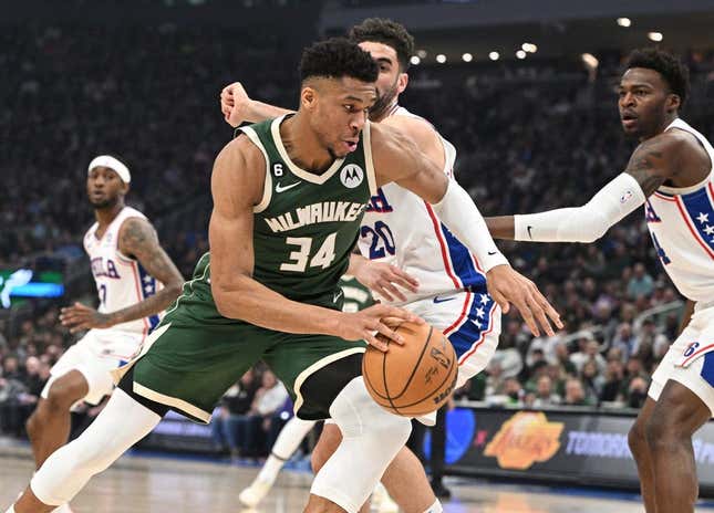 Mar 4, 2023; Milwaukee, Wisconsin, USA; Milwaukee Bucks forward Giannis Antetokounmpo (34) drives to the basket against Philadelphia 76ers forward Georges Niang (20) in the first half at Fiserv Forum.
