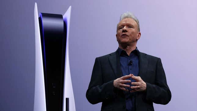 Jim Ryan appears on a stage in front of a PS5. 