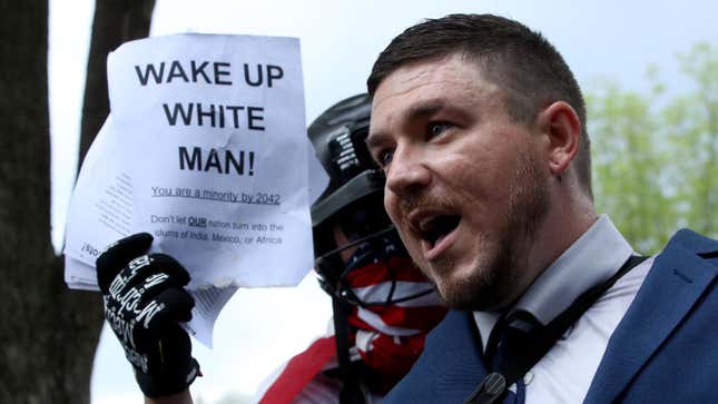 WASHINGTON, DC - AUGUST 11: Jason Kessler (C), who organized the rally, speaks as white supremacists, neo-Nazis, members of the Ku Klux Klan and other hate groups gather for the Unite the Right rally in Lafayette Park across from the White House August 12, 2018 in Washington, DC. Thousands of protesters are expected to demonstrate against the "white civil rights" rally, which was planned by the organizer of last year’s deadly rally in Charlottesville, Virginia.