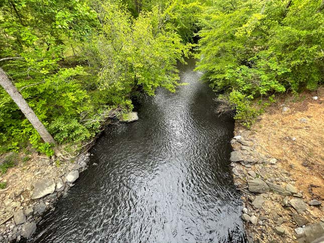 Davis Creek runs black with pollution.