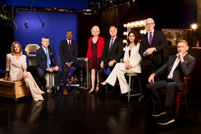 This image released by CBS News shows, from left, Sharyn Alfonsi, L. Jon Wertheim, Bill Whitaker, Lesley Stahl, Scott Pelley, Cecilia Vega, Anderson Cooper and Executive Producer Bill Owens, from the CBS news series &quot;60 Minutes.&quot; (Jai Lennard/CBS News via AP)