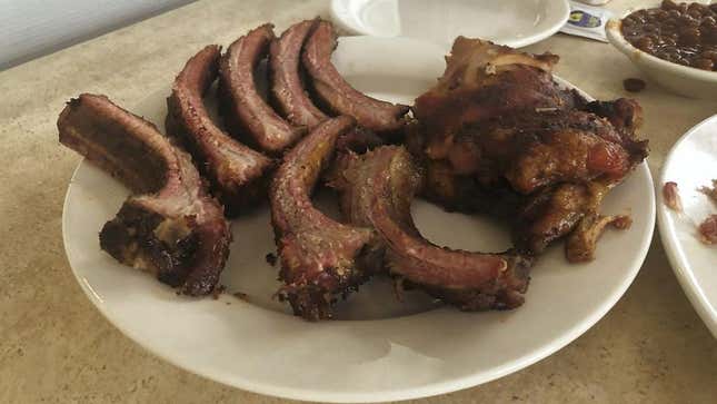 a plate of barbecued ribs and chicken