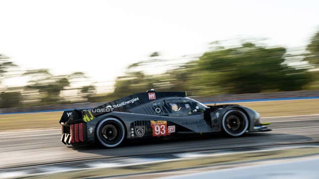 A photo of a grey Peugeot racing in Sebring. 