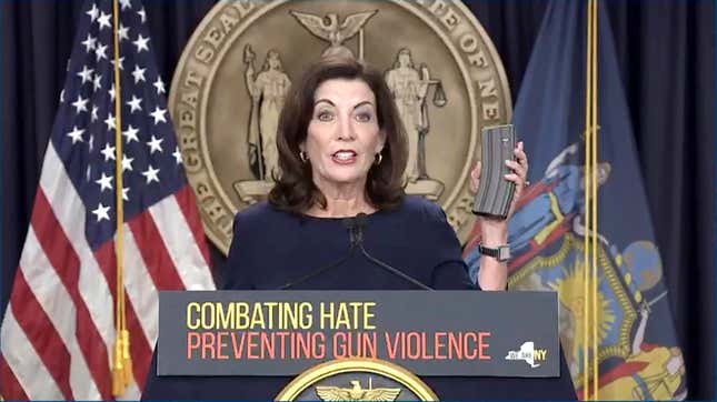 In this image taken from video, New York Gov. Kathy Hochul shows an extended rifle magazine during a news conference, Wednesday, May 18, 2022, in New York. New York would require state police to seek court orders to keep guns away from people who might pose a threat to themselves or others under a package of executive orders and gun control bills touted Wednesday by Hochul in the aftermath of a racist attack on a Buffalo supermarket. 