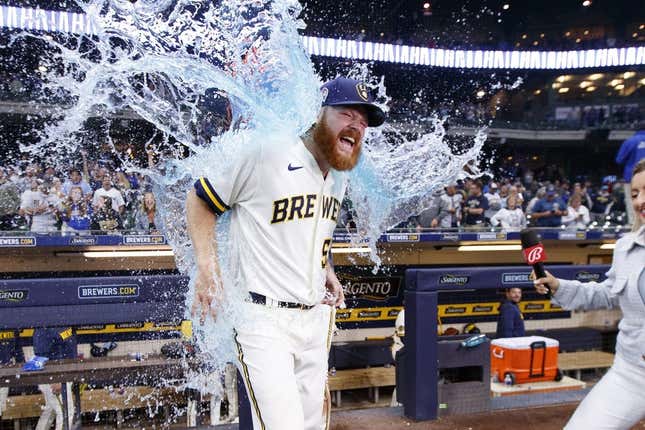 Sep 11, 2023; Milwaukee, Wisconsin, USA;  Milwaukee Brewers pitcher Brandon Woodruff (53) gets dunked with Gatorade following the game against the Miami Marlins at American Family Field.