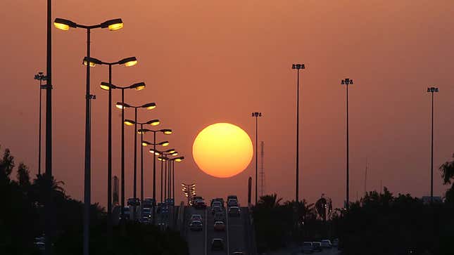 A photo of sunset over a highway in Kuwait. 