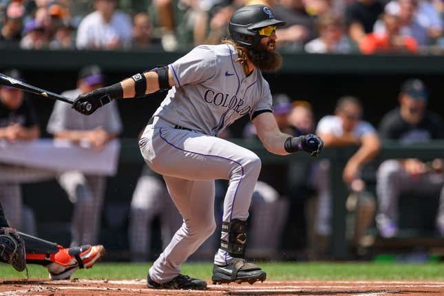 Aug 27, 2023; Baltimore, Maryland, USA; Colorado Rockies designated hitter Charlie Blackmon (19) hits a single during the first inning against the Baltimore Orioles at Oriole Park at Camden Yards.
