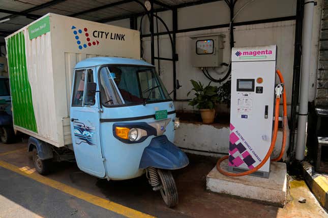 Santhosh Kumar, 23, an electric rickshaw delivery driver for logistics company City Link leaves the company premises to pick a load from a customer in Bengaluru, India, Wednesday, May 31, 2023. While Kumar doesn&#39;t have his own electric vehicle yet — the one he drives belongs to the company — he dreams of buying his own, or even several that he can rent out. (AP Photo/Aijaz Rahi)