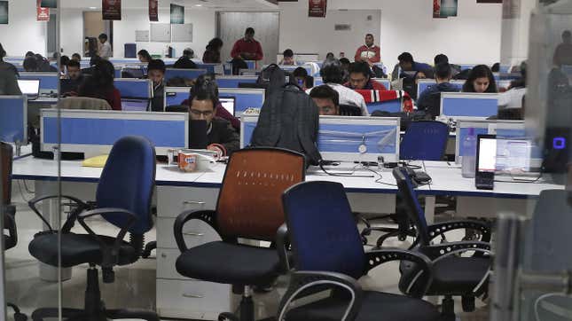 Employees of Shopclues.com work inside their office in Gurgaon