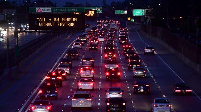 Brakelights come on as vehicles head east out of Los Angeles on the Interstate 10 freeway in Alhambra, California on May 27, 2021, ahead of the Memorial Day weekend.