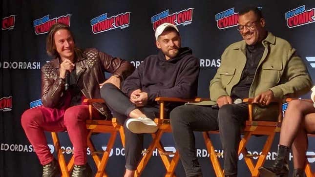 Matt Mercer is seen holding a microphone seated next to Cody Christian (the voice of Cloud Strife) and John Eric Bentley (the voice of Barret Wallace) at a panel of voice actors from Final Fantasy VII Rebirth at New York Comic Con 2023. 