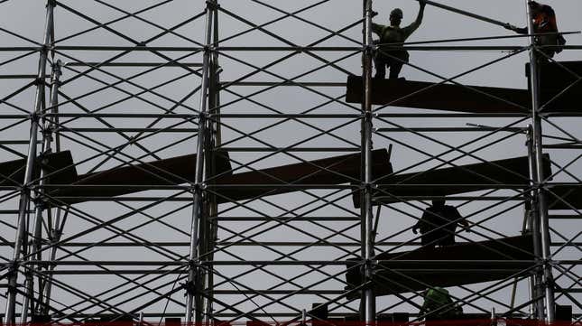 Workers dismantle scaffolding at the Hudson Yards construction project is pictured in the Manhattan borough of New York City, New York, U.S. May 24, 2017. 