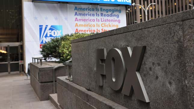 A view outside the Fox News Building with the big Fox sign out front and Fox News America is listening
