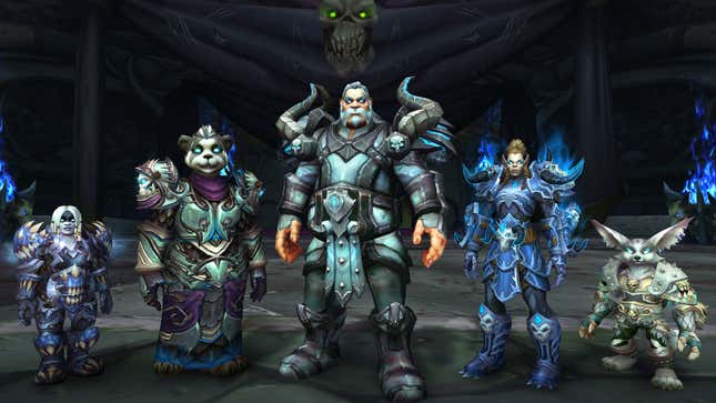 World of Warcraft characters of various races standing in a dark dungeon. 