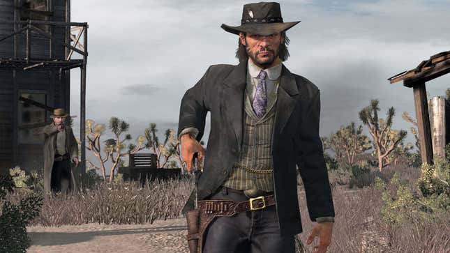 A man wearing a black hat holsters his revolver in an old desert town. 