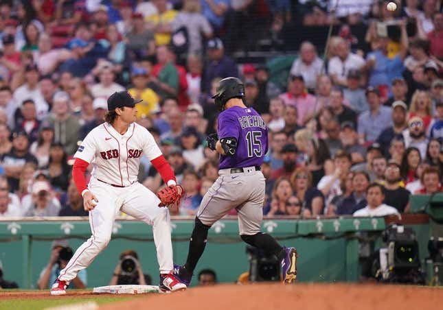 Jun 12, 2023; Boston, Massachusetts, USA; Colorado Rockies right fielder Randal Grichuk (15) gets a base hit and the Rockies score on a a poor throw to Boston Red Sox first baseman Triston Casas (36) in the fourth inning at Fenway Park.