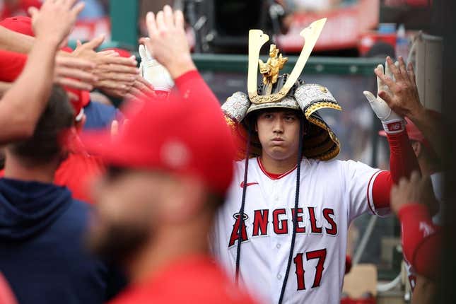 Jul 23, 2023; Anaheim, California, USA;  Los Angeles Angels designated hitter Shohei Ohtani (17) is greeted in the dugout after hitting a home run during the first inning against the Pittsburgh Pirates at Angel Stadium.