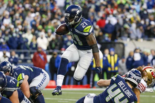 Dec 5, 2021; Seattle, Washington, USA; Seattle Seahawks running back Adrian Peterson (21) rushes against the San Francisco 49ers during the fourth quarter at Lumen Field.