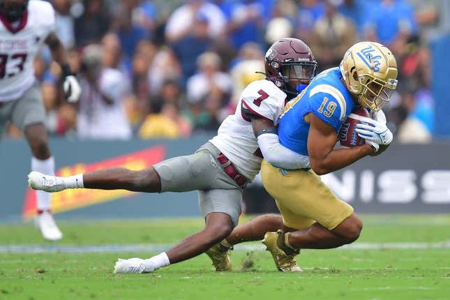 Sep 16, 2023; Pasadena, California, USA; UCLA Bruins wide receiver Kyle Ford (19) is brought down by North Carolina Central Eagles defensive back JaJuan Hudson (7) during the first half at Rose Bowl.