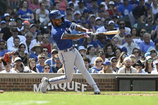 Aug 20, 2023; Chicago, Illinois, USA;  Kansas City Royals third baseman Maikel Garcia (11) hits an RBI single against the Chicago Cubs during the ninth inning at Wrigley Field.