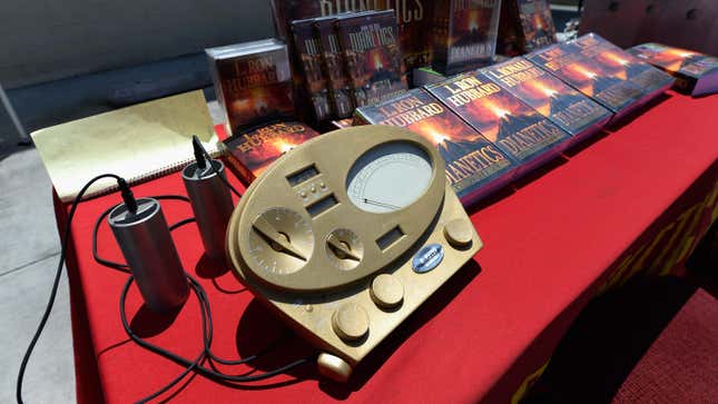 The Scientology E-Meter and cans are show along with books by L. Ron Hubbard, founder of Chruch of Scientology, at the Church of Scientology community center in the neighborhood of South Los Angeles on June 5, 2013