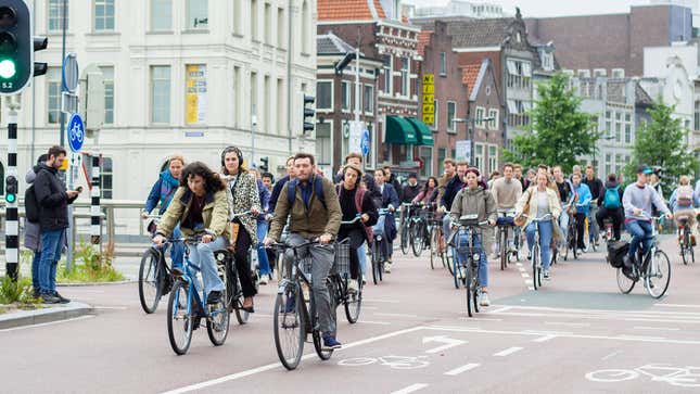 A photo of people cycling to work in Amsterdam. 