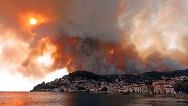 Flames burn on the mountain near Limni village on the island of Evia, about 160 kilometers (100 miles) north of Athens, Greece, Tuesday, Aug. 3, 2021.