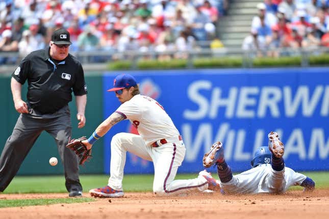 Jun 11, 2023; Philadelphia, Pennsylvania, USA; Los Angeles Dodgers right fielder Mookie Betts (50) steals second base ahead of tag by Philadelphia Phillies second baseman Bryson Stott (5) during the second inning at Citizens Bank Park.
