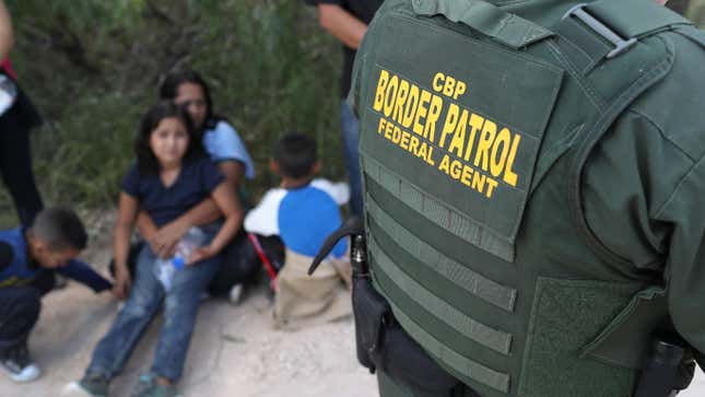 U.S. Border Patrol agents, part of Customs and Border Protection, as they detain Central American asylum seekers near McAllen, Texas in June 2018.